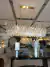 Lustre de cristal retangular 120x32 Nova Deli pendurado em uma sala de jantar elegante. Lustres Gênesis loja online de Lustres e Iluminação Decorativa