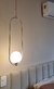 Pendente Moderno Shen Grande Globo Leitoso instalado ao lado de uma cama em um quarto moderno. Lustres Gênesis loja online de Lustres e Iluminação Decorativa