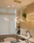 Lustre pendente moderno de LED Lace dourado instalado em um escritório contemporâneo. Arandela Moderno Botton de LED Dourada da SkyLight, modelo SKY-3111AR-DO, com design circular e detalhes texturizados. Lustres Gênesis Site online venda de Lustres e Ilu