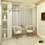 Lustre Pendente Moderno de Cristal Flora em uma sala de estar elegante com cadeiras e decoração neutra. Lustres Gênesis Site online venda de Lustres e Iluminação decorativa