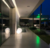 Luminária de chão esfera Soleil branca iluminando área externa de uma casa moderna à noite. Lustres Gênesis loja online de Lustres e Iluminação Decorativa