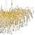 Lustre pendente de cristal moderno em forma de galho com detalhes dourados e pingentes transparentes.