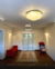 Lustre de Cristal Ø60 Harion Transparente iluminando sala de estar com decoração moderna. Lustres Gêneiss loja online de Lustres e Iluminação Decorativa