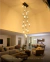 Lustre Pendente Moderno Dunáh 21 Tubos Fumê em sala com pé direito duplo. Lustres Gênesis loja online de Lustres e Iluminação Decorativa