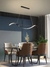 Lustre pendente de LED moderno Ballet preto instalado em sala de jantar elegante com mesa de vidro e cadeiras estofadas. Lustres Gênesis Site online venda de Lustres e Iluminação Decorativa