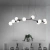 Lustre pendente moderno Colli Preto em uma sala de jantar minimalista. Arandela Moderno Botton de LED Dourada da SkyLight, modelo SKY-3111AR-DO, com design circular e detalhes texturizados. Lustres Gênesis Site online venda de Lustres e Iluminação Decorat