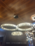 Lustre pendente de cristal com três anéis dourados, ideal para pé direito duplo e escadas. Lustres Gênesis Site online venda de Lustres e Iluminação