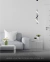 Pendente Moderno Zeon Preto iluminando sala de estar minimalista com sofá cinza e mesa lateral. Lustres Gênesis loja online de Lustres e Iluminação Decorativa