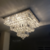 Lustre plafon de cristal quadrado iluminado, ideal para sala de jantar e quartos. Lustres Gênesis loja online de Lustres e Iluminação Decorativa. 