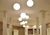 Luminária de teto pendente esfera branca Ø90cm em ambiente de pé direito alto Lustres Gênesis loja online de Lustres e Iluminação Decorativa