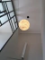 Luminária de Teto Pendente Lua Moon Esfera Ø60 instalada em um espaço com pé direito alto. Lustres Gênesis loja online de Lustres e Iluminação Decorativa