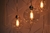 Lustre pendente Sarvah com 15 globos transparentes iluminados. Lustres Gênesis loja online de Lustres e Iluminação Decorativa