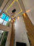Lustre pendente Sarvah com 15 globos fumê em ambiente de pé direito duplo Lustres Gênesis loja online de Lustres e Iluminação Decorativa