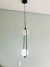 Luminária pendente Shen com 2 globos leitosos de design industrial. Lustres Gêneis loja online de Lustres e Iluminação Decorativa
