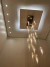 Lustre Pendente Moderno Dunáh com 21 tubos de vidro fumê, ideal para casas com pé direito duplo e alto. Lustres Gênesis loja online de Lustres e Iluminação Decorativa