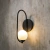 Arandela de parede Shen 60cm com design industrial, ideal para quartos e cabeceira de cama. Lustres Gênesis loja online de Lustres e Iluminação Decorativa