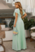 conjunto de blusa e saia longa plissada na cor verde menta, com detalhes em malha lurex.