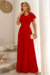 Conjunto de blusa e saia longa plissada na malha lurex na cor vermelha, destacando detalhes das mangas e caimento da saia.