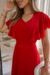 Conjunto de blusa e saia longa plissada na malha lurex na cor vermelha, destacando detalhes das mangas e caimento da saia.
