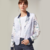 BLAZER CAMPERA CLEMENTINA LINO ESTAMPADO FLORES AZULES Y VIOLETAS CON CAPA DE NYLON BLANCA - comprar online