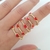 Anillo B16 corazones rojos