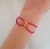 Pulsera trinity cz dorado hilo rojo