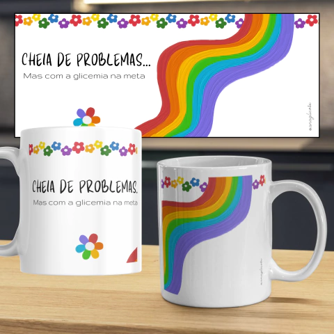 Caneca com a frase "Cheia de problemas, mas com a glicemia na meta", decorada com flores coloridas e um arco-íris.