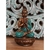 Estátua de Buda em posição de meditação, com detalhes em bronze e azul, usada como porta-vela.