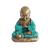 Escultura em resina de um monge, representando serenidade, com roupas azuis e detalhes dourados, sentado em posição de meditação.