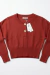 SWEATER CORTO CON BOTONES EN DORADO en internet