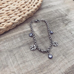 Pulsera Ojitos + Mundo - Acero quirúrgico Y1