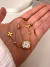 Pulsera Cubik Flor Blanco 19 cm Acero Dorado - comprar online