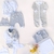Conjunto Ártico gris+ conjunto blanco+ dos bodies+ enterito+ manta+ campera+ babero bandana