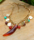 Colar boho dourado com dente de sabre marrom mesclado - comprar online
