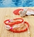 Trio de pulseiras búzios + miçangas laranja