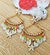 Brinco Delux dourado e neon colorido com estrelas e cascalhos