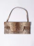 Cartera sobre prune Cuero Reptil (102166) - comprar online