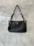 Bolsa Prada Tessuto Hobo preta com alça longa Italiana