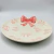 Prato de Sobremesa Cerâmica Laço Branco Rosa 21cm - Patricia Kelly Home Decor