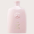 Botella de champú anti-caspa Serene Scalp de Oribe en color rosa, con detalles dorados.