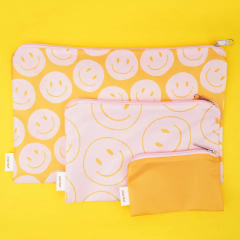 Tres estuches de viaje de distintos tamaños