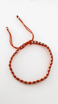 Pulsera hilo bolitas red - Coquetas Accesorios