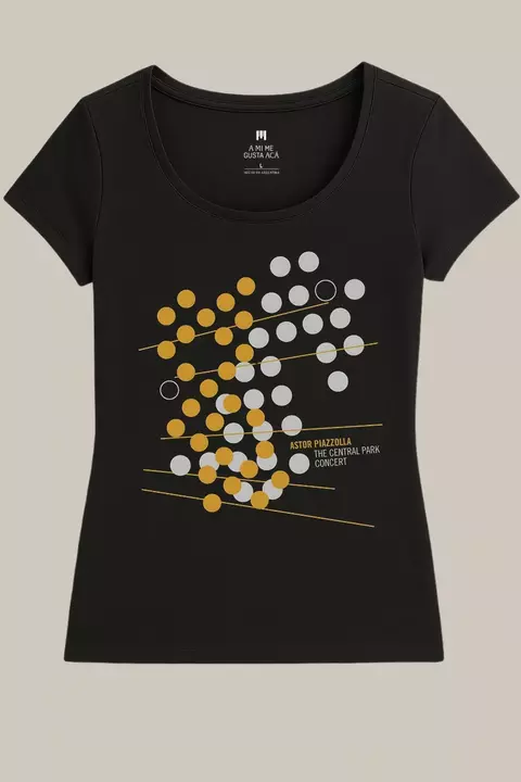 Remera negra de mujer con diseño gráfico de puntos dorados y blancos, texto "Astor Piazzolla The Central Park Concert"