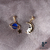 Aretes abrazando la luna (azul) en internet