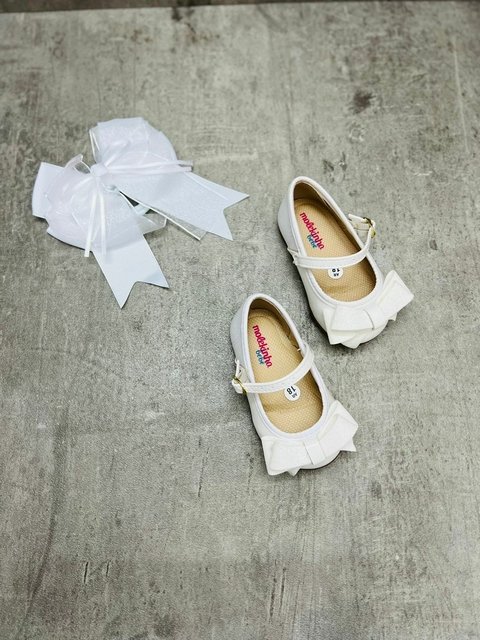GUILLERMINA BLANCA CON MOÑO Y TALON DE GLITTER 4401 4485 3727 6236