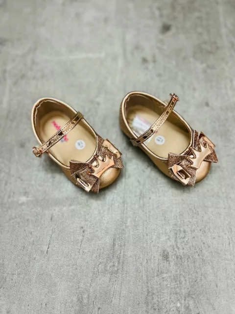 GUILLERMINA ORO ROSA CON MOÑO Y CORONA 6230