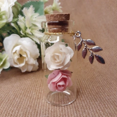 souvenir frasquito con dos rosas en internet