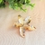Broche de Flor Estrela Dourado