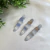 Kit com 3 presilhas Finger Tips em metal prateado com design ondulado. Ideal para prender mechas com estilo e delicadeza. Pistache Acessórios.