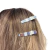 Kit com 3 presilhas Finger Tips em metal prateado com design ondulado. Ideal para prender mechas com estilo e delicadeza. Pistache Acessórios.